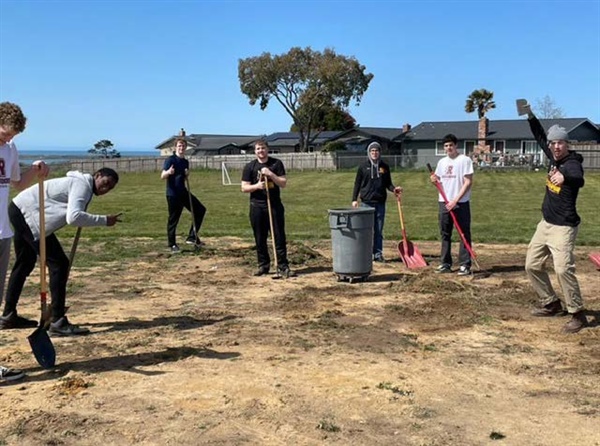 CR Basketball Team Donates Field Maintenance to Local Elementary School